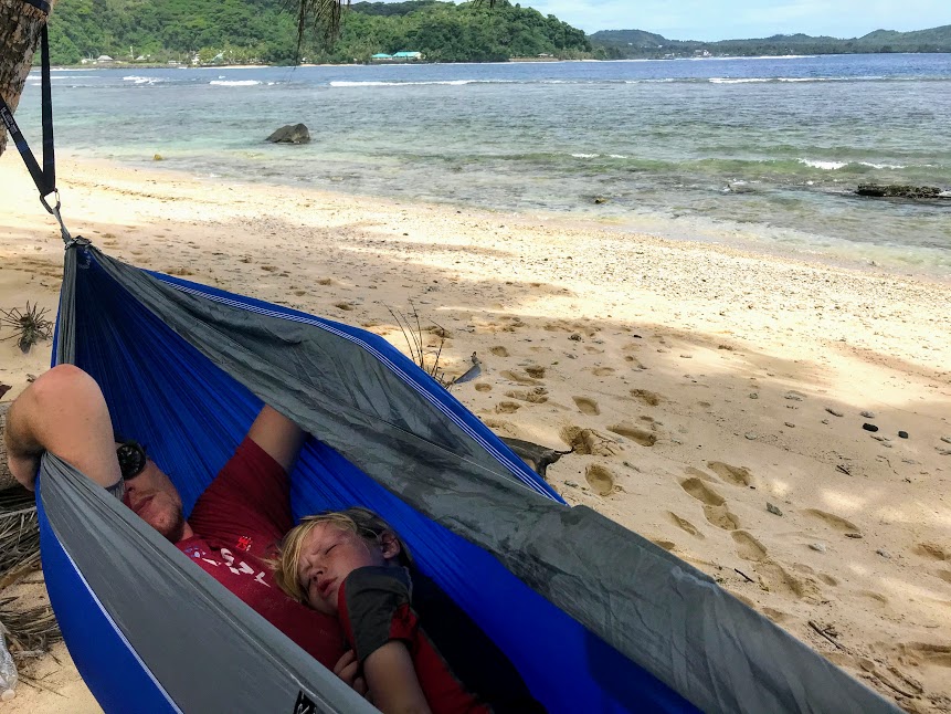 Nate and Holden napping in a beach hammock