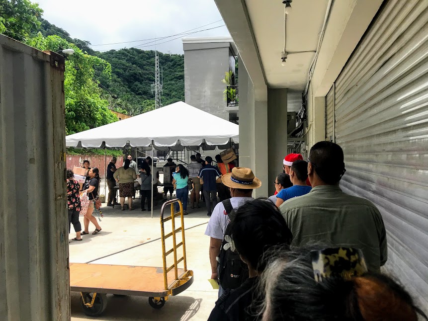 People waiting patiently for their Christmas packages at the post office