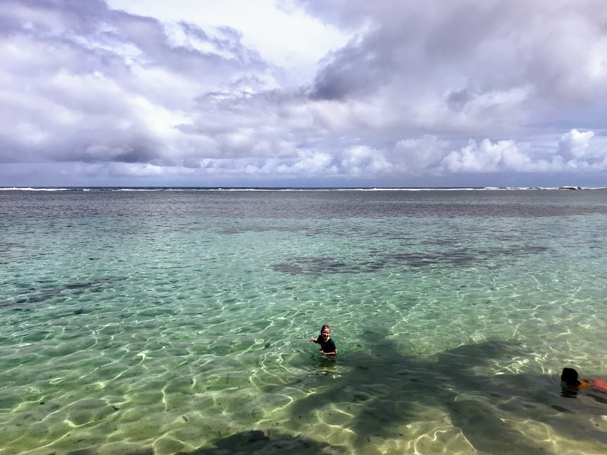 Children playing in the ocean during cyclone season in American Samoa