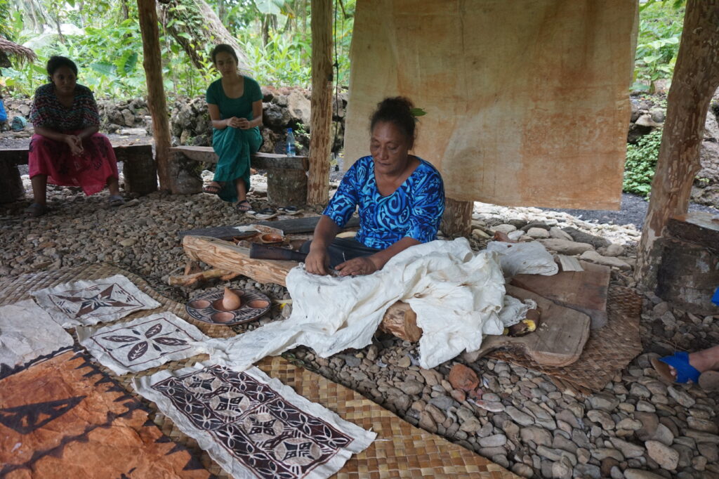 Woman creating traditional siapo 