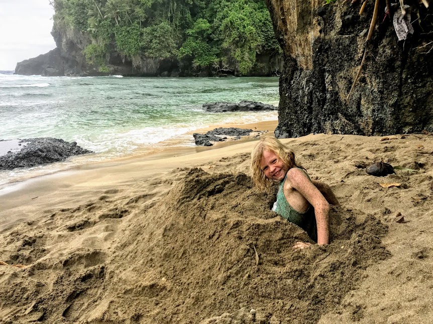 Boy buried in the sand