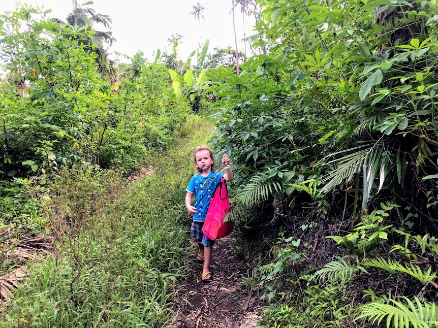 Young boy hiking to Fogama'a 