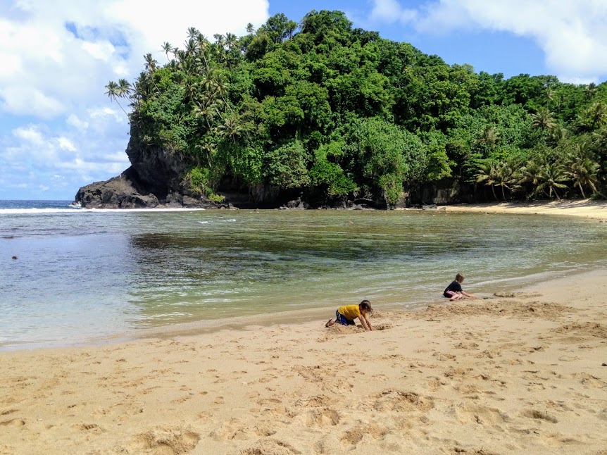 Young boys playing in the sand at Fogama'a